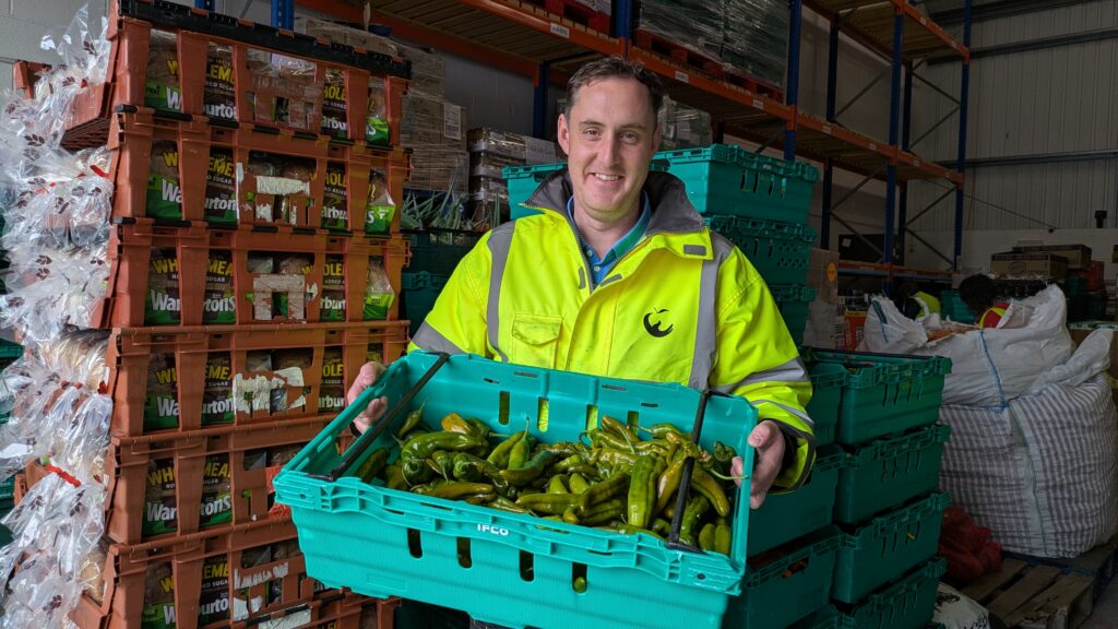 Volunteer Ryan with some surplus food