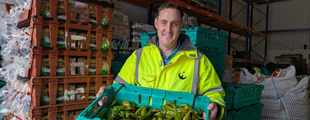 Volunteer Ryan with some surplus food