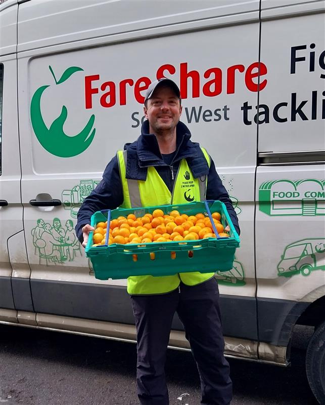 Volunteer driver's assistant with a FareShare South West van