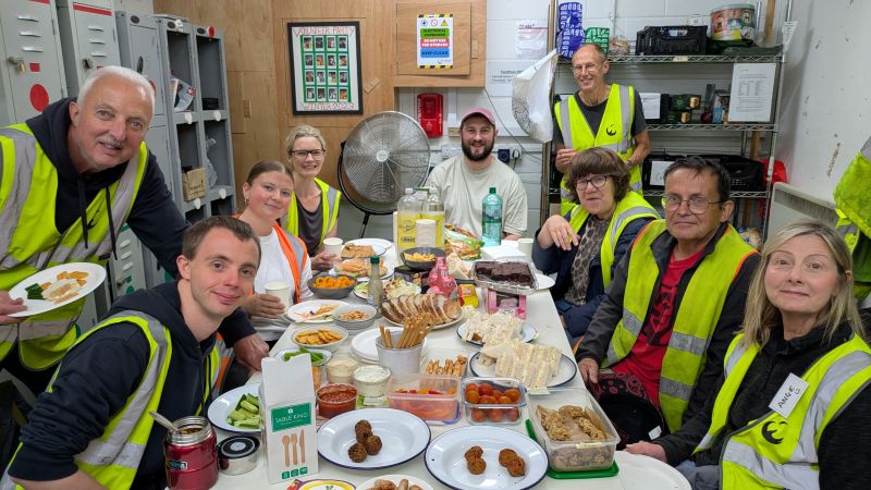 Volunteers enjoying a well earned sit down and food to celebrate Volunteers Week