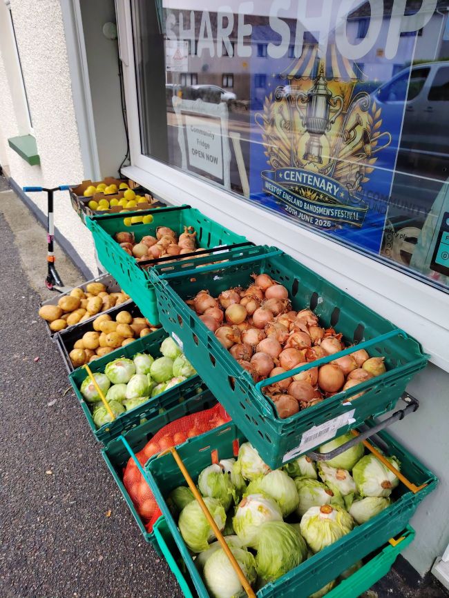 Crates of fresh food outside Bugle Library of Things, who runa community shop and outreach van.