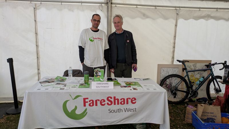 FareShare South West Food Manager Daniel with Charlie Bigham, standing at the FareShare South West stall at Wells Food Festival.